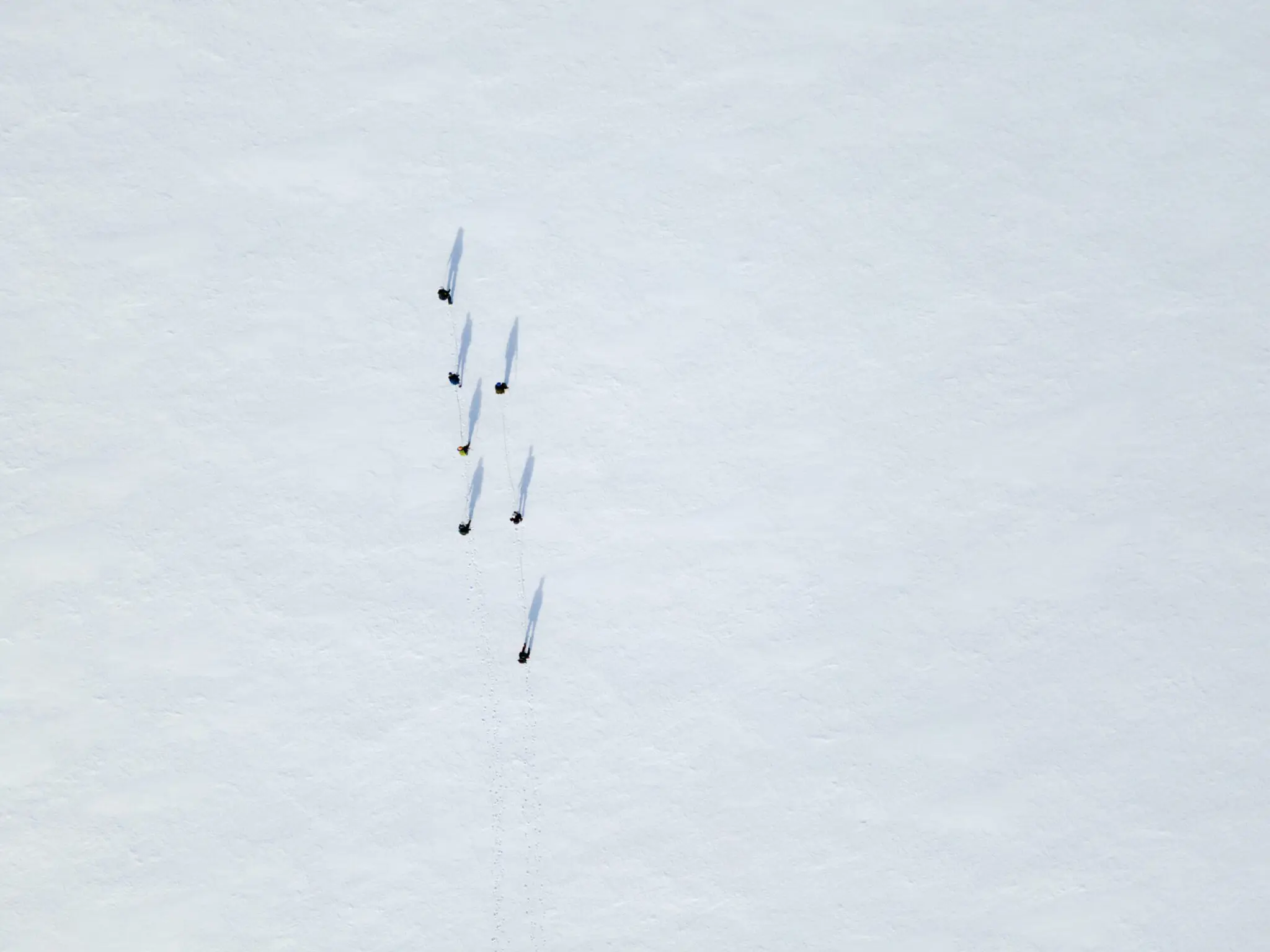 People skiing on a glacier.