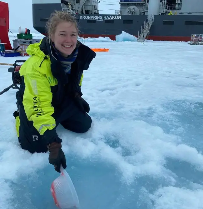 Fishing up slush with a colander.